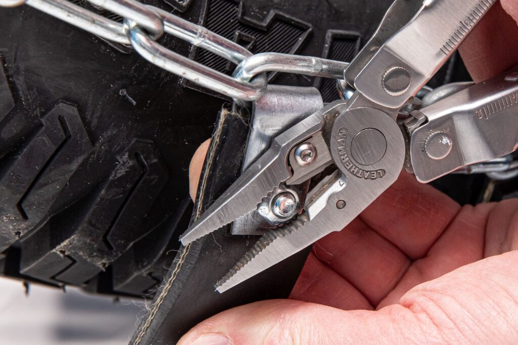 Remove the nut with a wrench or plyers.