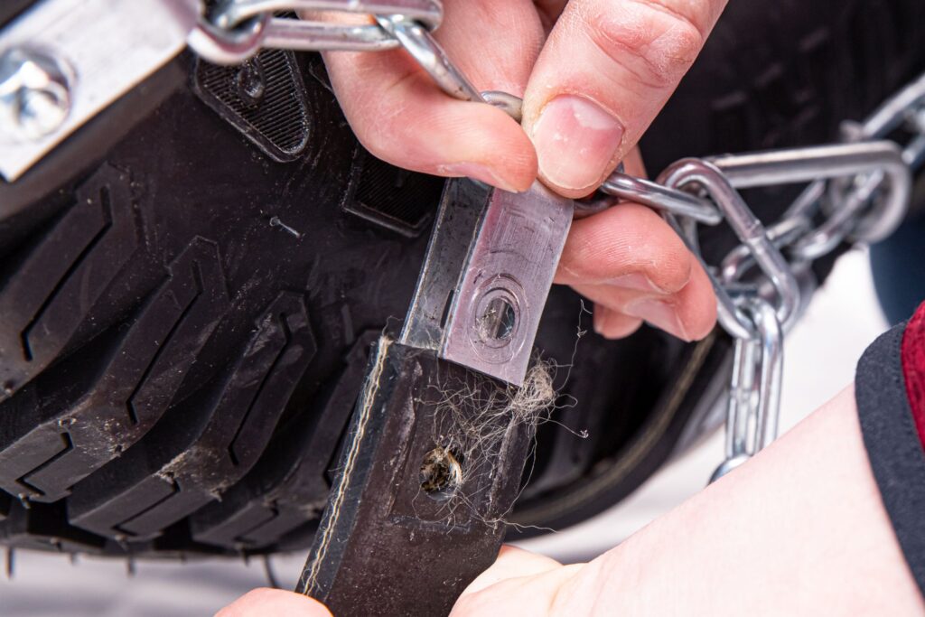 Remove the strap from the metal clip.